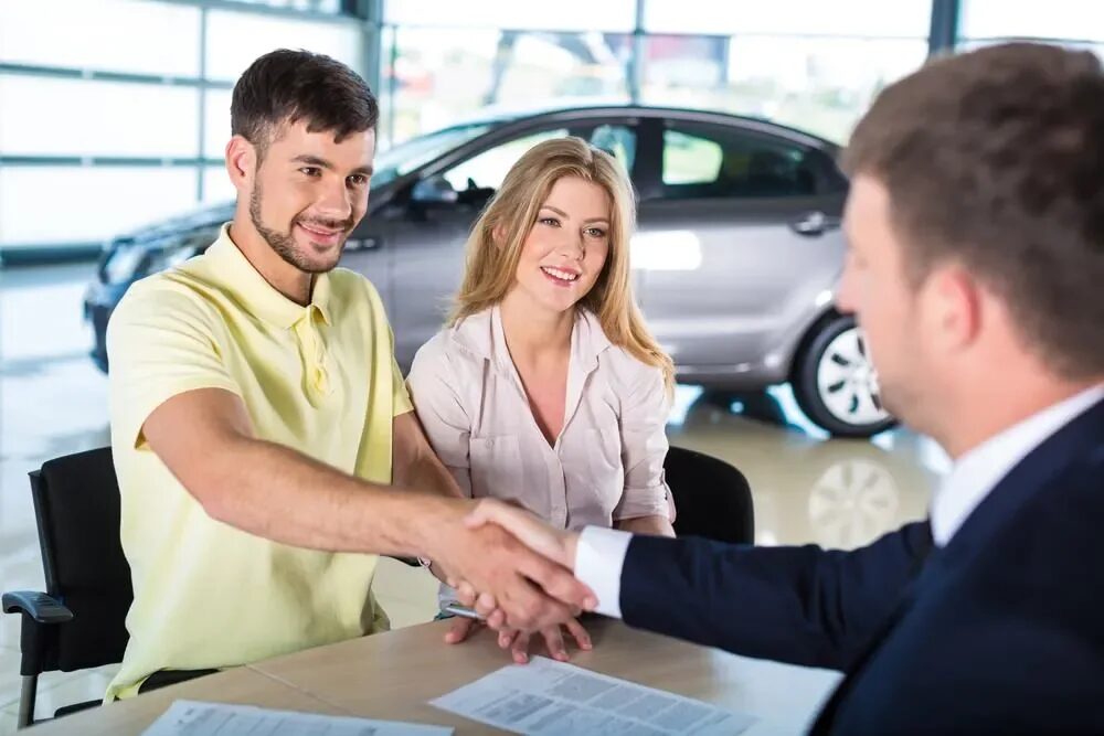 Man and woman discussing car finance options