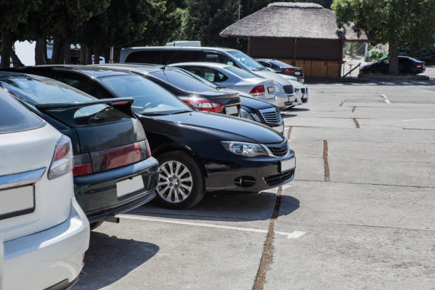 A row of parked cars in a parking lot