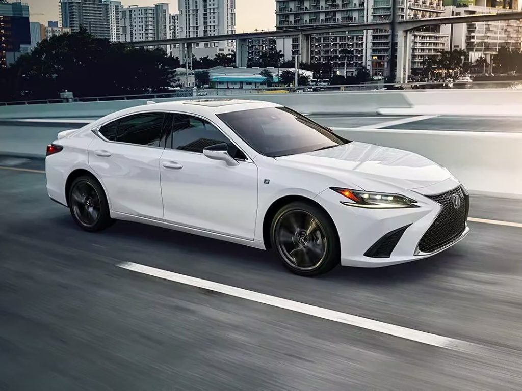 A sleek, white sedan with black-tinted windows