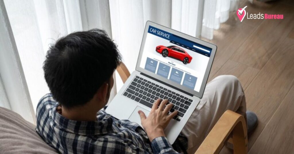 A person shows online car leads on the laptop