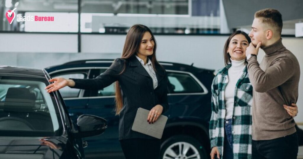 A saleswomen shows new car to customer